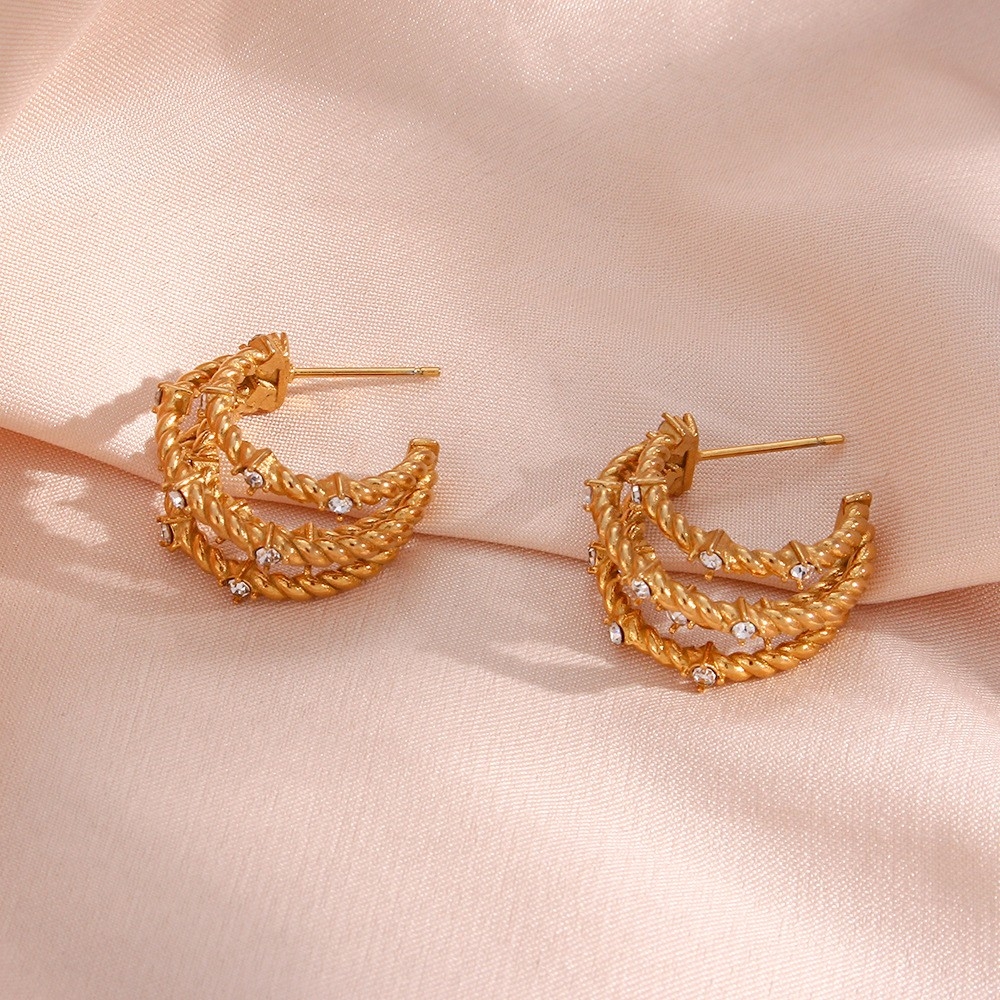 European and American INS Fashionable Unique Trendy Ear Hoops: Stainless Steel Multi-Layer Twisted Braided Zircon Banana-Shaped Earrings