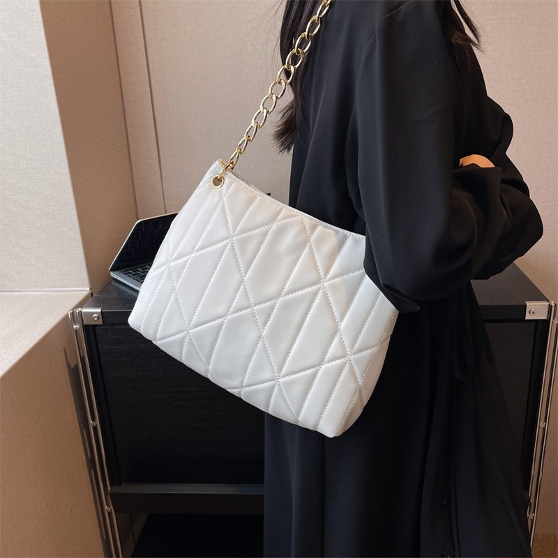 Graphic Diamond Crossbody, 2024: Tactile Quilted Style Effortlessly Polished for Work or Weekend